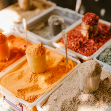 Vibrant assortment of spices at an outdoor market in Georgia, showcasing flavor diversity.
